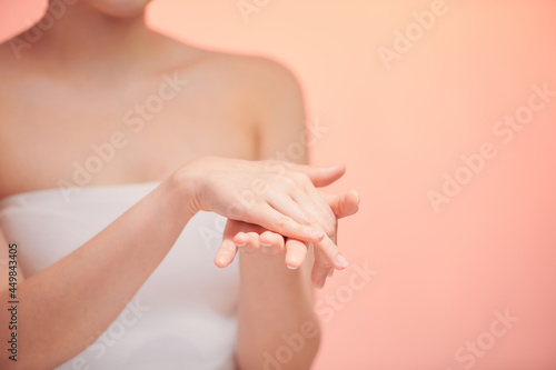 Fototapeta Naklejka Na Ścianę i Meble -  Beautiful women hands isolate, applying cream, massaging