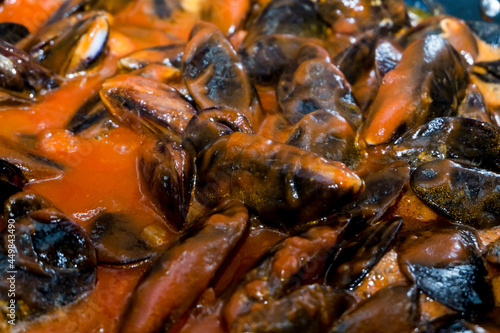close-up of natural mussels cooked with tomatoes