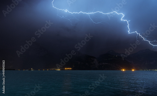 Lightning over mountains and Lake Lucerne. Switzerland. Europe. Storm.