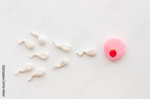 фотографія Sperm cells swim to egg female ovum. Pregnancy concept