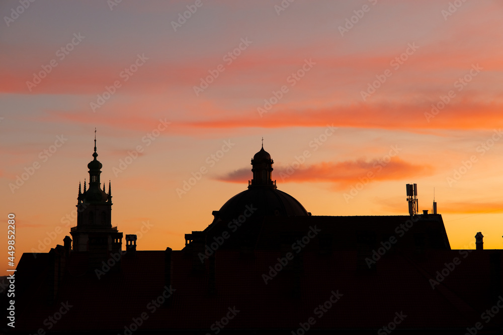 cathedral dome silhouette in evening sunset dusk orange sky outdoor scenic background view