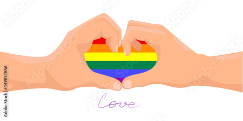 Hands forming a heart with rainbow color. Heart in the color of the rainbow as a symbol of tolerance and LGBT pride.