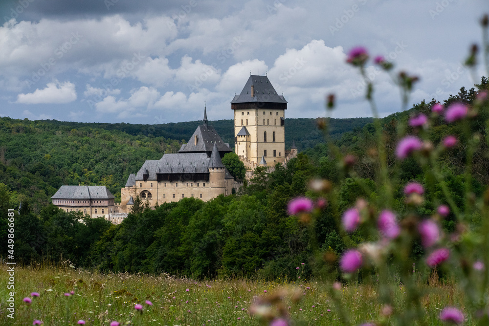 Karlstejn Castle, historical building of the Czech Republic in the summer blooming scenery. Popular tourist destination/attraction near Prague.