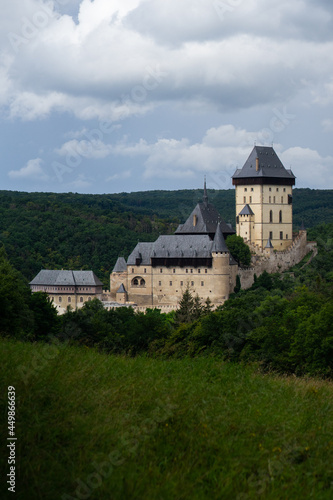 Karlstejn Castle  historical building of the Czech Republic in the summer blooming scenery. Popular tourist destination attraction near Prague.