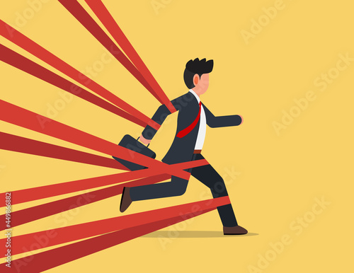 Businessman tied up with red tape trying to run away with full effort. struggling concept