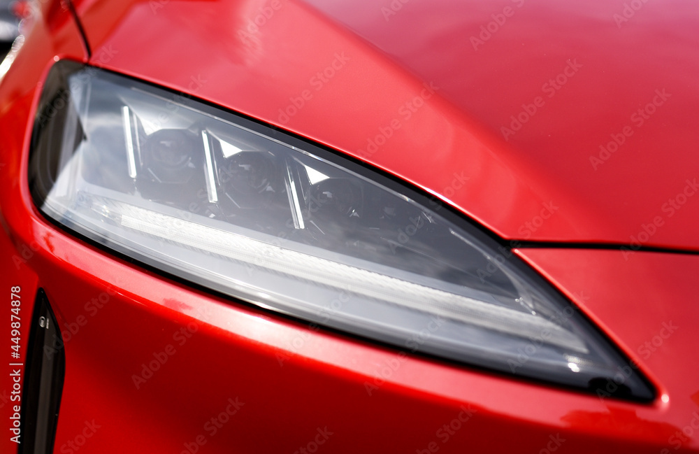 Headlight. LED headlamp of a modern car. Frontal lighting of highway vehicles with daytime running lights. Cars ambient lighting. Bi-Xenon headlamps and LED automotive lighting of a next generation.