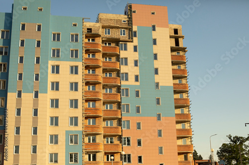 Apartment building in summer. Residential building in the city.
