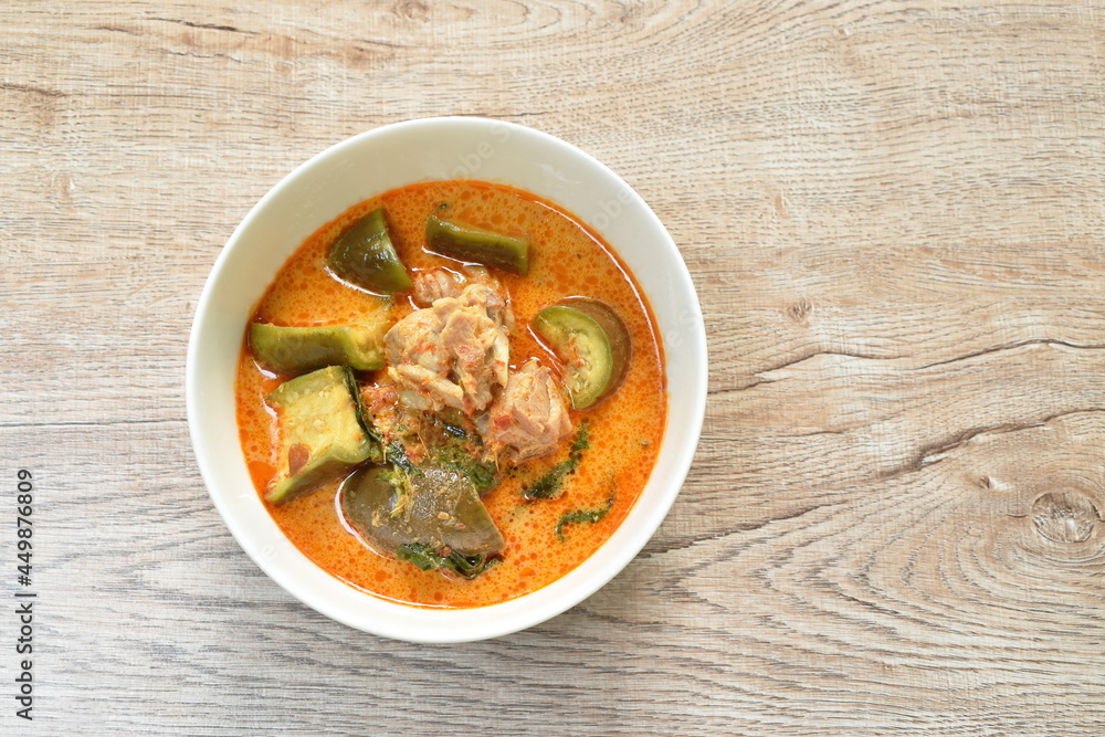 spicy boiled chicken with slice long eggplant in coconut milk green curry soup on bowl spicy boiled chicken with slice long eggplant in coconut milk green curry soup on bowl
