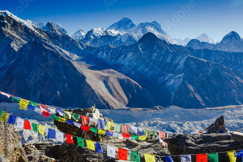 Colorful prayer flags on the Everest Base Camp trek in Himalayas, Nepal. View of Mount Everest and Mountain Peak Nuptse