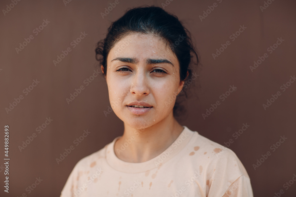 Stressed woman suffering of heatstroke refreshing with cold water outside. Weather abnormal exreme heat concept Stressed woman suffering of heatstroke refreshing with cold water outside. Weather abnormal exreme heat concept