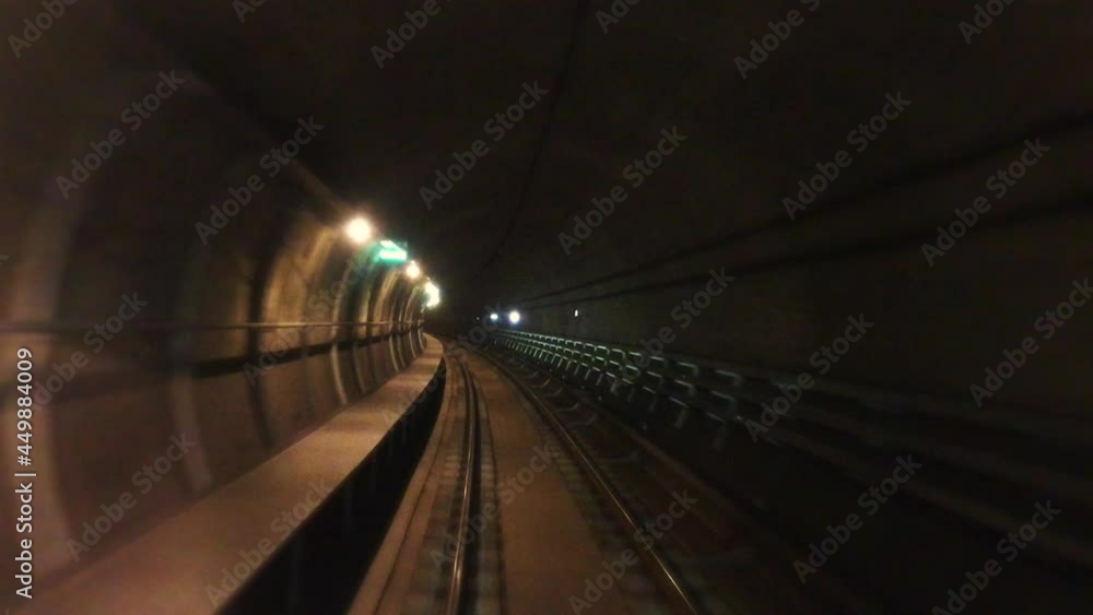 Front view of train running in a dark metro subway tunnel as video seen from driver’s seat. Front view of train running in a dark metro subway tunnel as video seen from driver’s seat.