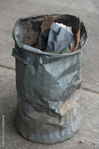 portrait of a metal trash can