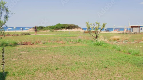 Seaview from hotel room. Scorched lawn on blue sky background. Greece. Nea Potidaea. photo