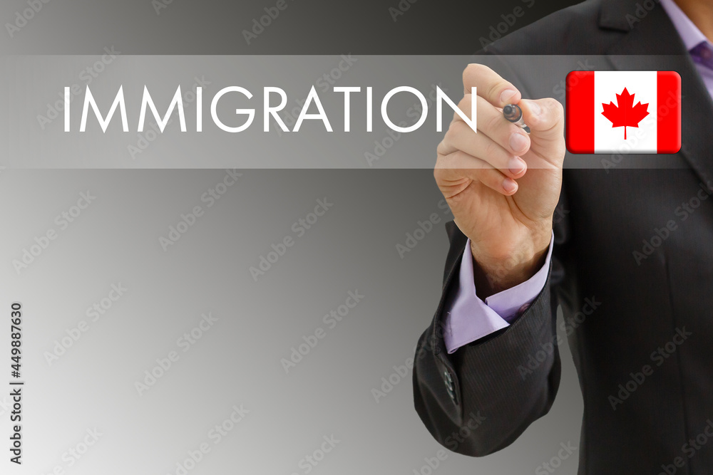 Concept of immigration to Canada with virtual button pressing - obrazy, fototapety, plakaty 