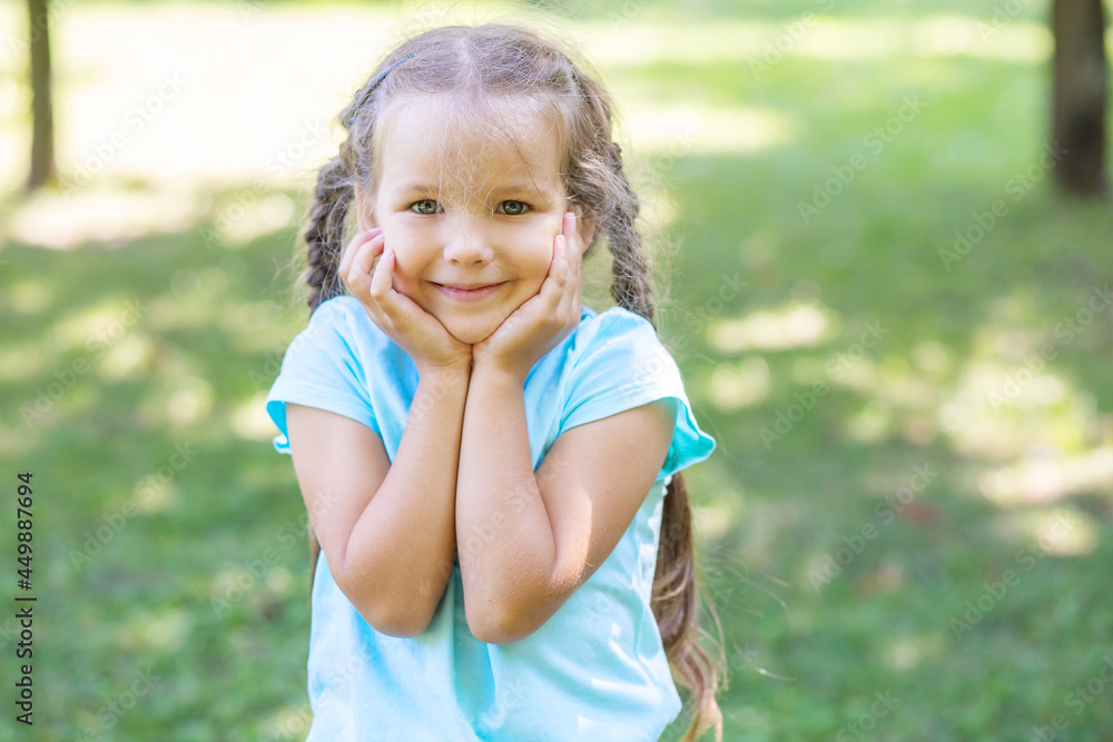 Joyful emotions of a little cute girl, close-up portrait of a child.
Joyful emotions of a little cute girl, close-up portrait of a child.