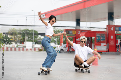 young couple skater enjoying and riding on skateboard