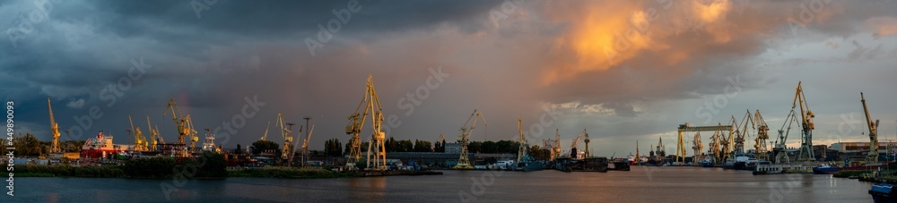 Panoramic view of Szczecin shipyards during a passing evening storm
