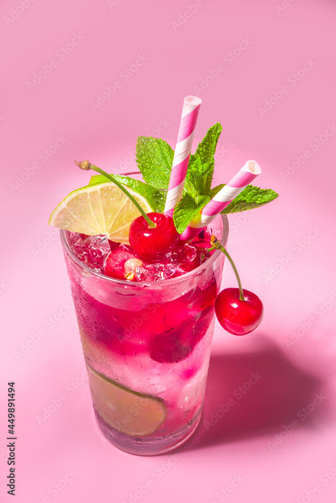 Cherry cocktail on color pink background Cherry cocktail on color pink background