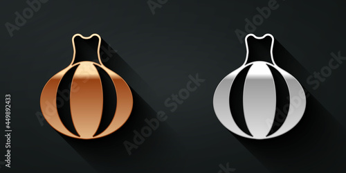 Gold and silver Onion icon isolated on black background. Long shadow style. Vector