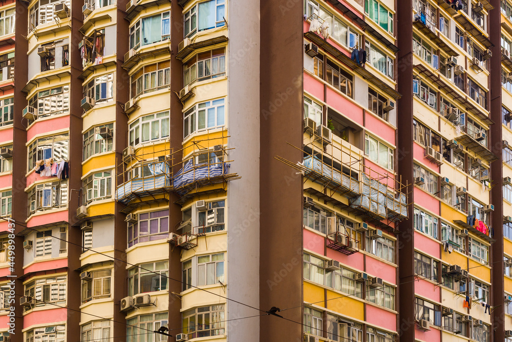 Close-up to a densely populated apartment building in Hong Kong.