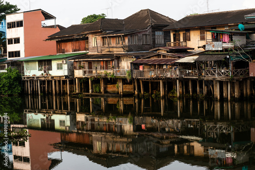 Vintage houses by the river and reflections in thailand