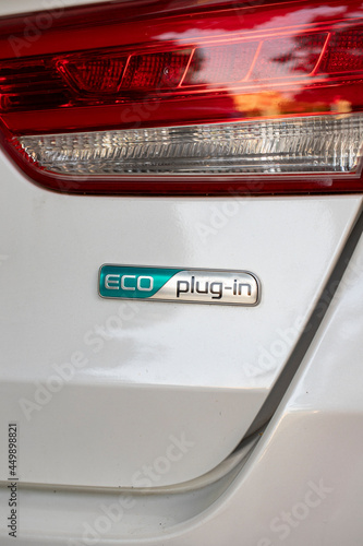 Eco plugin car. Rear shot of white car. close up © enezselvi