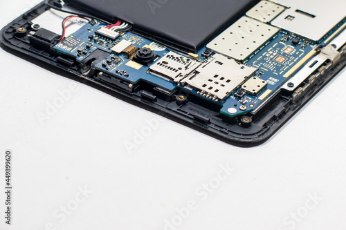 Electronics board inside split tablet isolated on white background