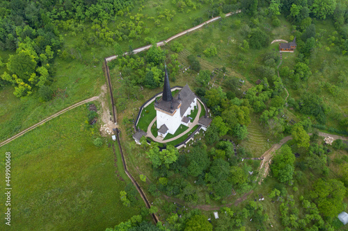 Aerial drone view of Valeni reformed church, Transylvania, Romania photo