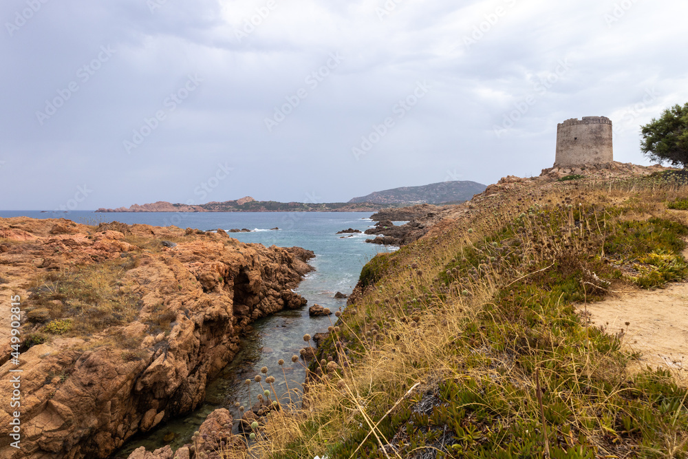 beautiful beach and characteristic reddish rocks of Isola Rossa and Aragonese Tower, Costa Paradiso. Trinità d'Agultu e Vignola, Sardinia, Italy, Europe