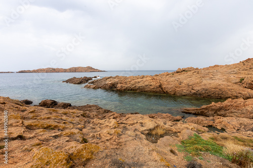 beautiful beach and characteristic reddish rocks of Isola Rossa, Costa Paradiso. Trinità d'Agultu e Vignola, Sardinia, Italy, Europe