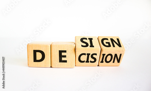 Decision or design symbol. Turned wooden cubes and changed the word 'design' to 'decision'. Beautiful white table, white background. Business, decision or design concept. Copy space.