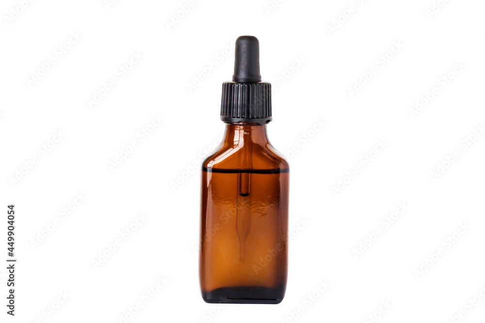 Fototapeta premium Brown bottle with drip dispenser isolated on white background.