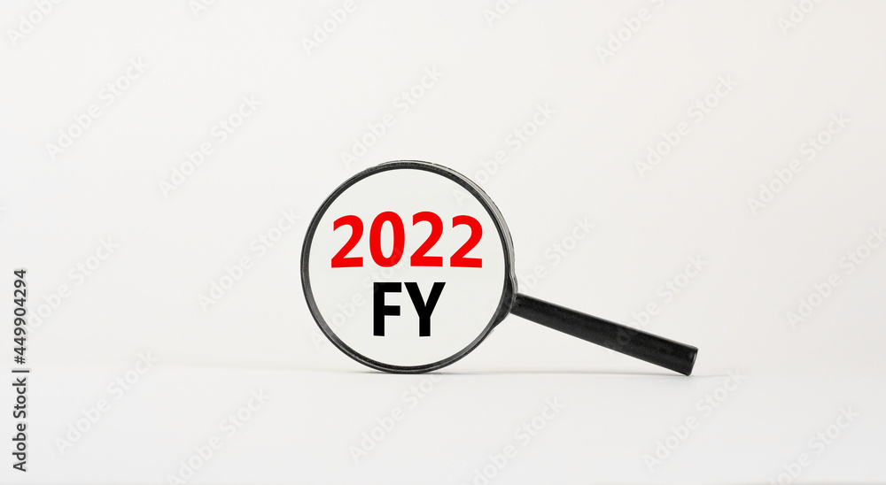 2022 FY fiscal new year symbol. Magnifying glass with words '2022 FY fiscal year' on beautiful white background. Business and 2022 FY fiscal new year concept, copy space. 2022 FY fiscal new year symbol. Magnifying glass with words '2022 FY fiscal year' on beautiful white background. Business and 2022 FY fiscal new year concept, copy space.