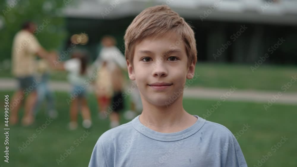 Portrait of positive caucasian schoolboy outdoors Portrait of positive caucasian schoolboy outdoors