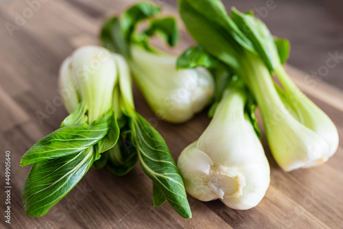 high angle view of fresh Bok Choy, chinese cabbage, on wooden cutting board