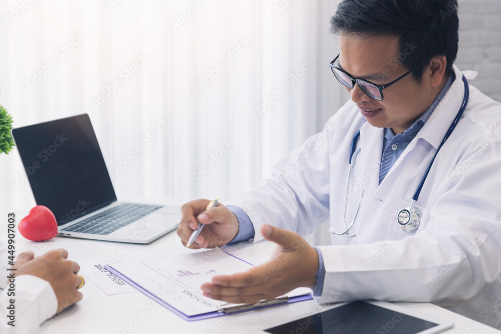 A doctor consulting and explain patient health check in office. Medicine and health care concept. A doctor consulting and explain patient health check in office. Medicine and health care concept.
