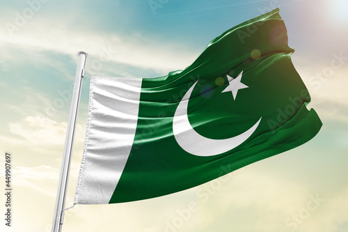 Pakistan national flag waving in beautiful sky. photo