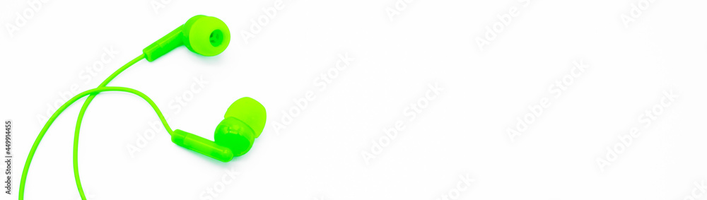 Banner with green EarPods Basic In-Ear Headphone Earbuds on white background, looks like a hug. Copy space