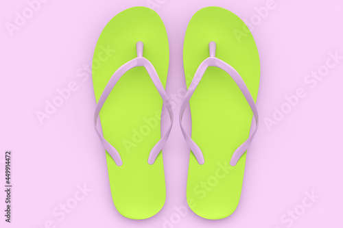 Beach green flip-flops or sandals isolated on pink background.