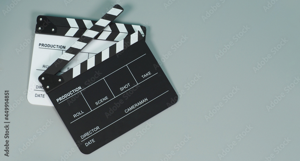 Black and white Clapperboard or clapper board or movie slate on gray background.