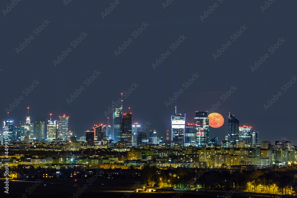 Moonrise over Warsaw, capital of Poland