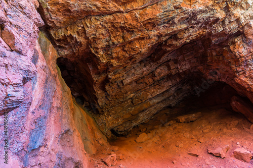 Small Cave Formed In The Red Limestome Walls of Condor Canyon, Panaca, Nevada, USA photo