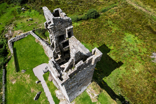 Aerial view of Castle Donovan, the remains of an Irish tower house in a valley near Drimoleague in Ireland