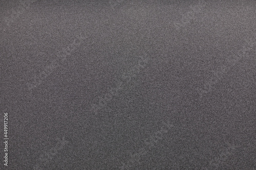 Close up of black sponge texture or surface.