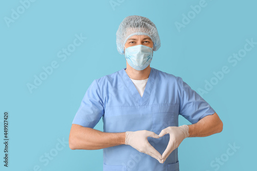 Cardiologist making heart w...