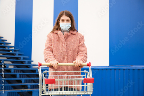 Young woman in medical mask...