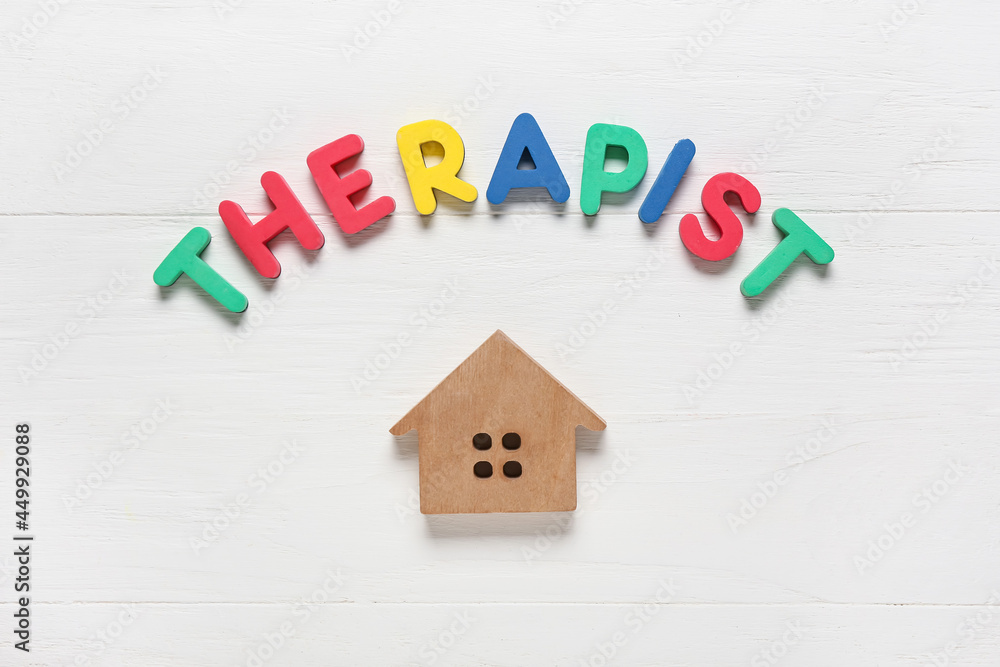 Word THERAPIST and house figure on white background Word THERAPIST and house figure on white background