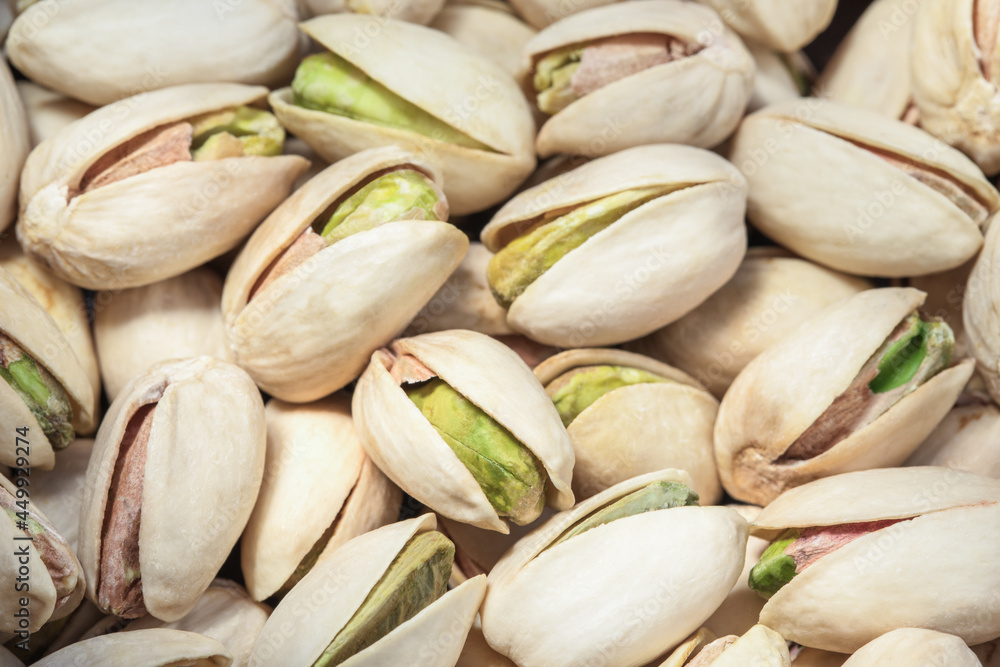 Pistachios texture and background. Tasty pistachios close up. Top view. Flat lay Pistachios texture and background. Tasty pistachios close up. Top view. Flat lay