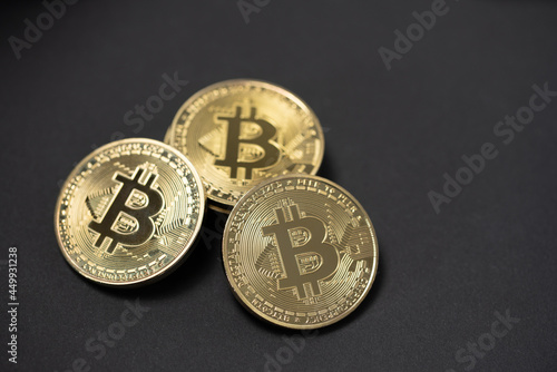 Gold Bitcoin coins on Black Background, Copyspace. Crypto Currency coins