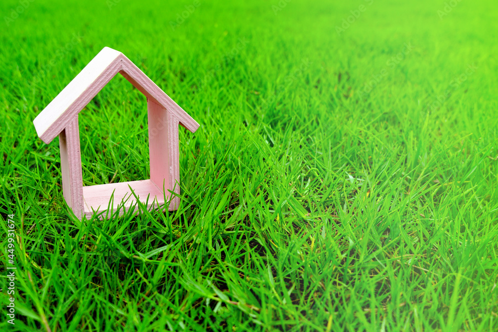 Pink small house on the green grass, garden or park at sunlight morning. Pink small house on the green grass, garden or park at sunlight morning.